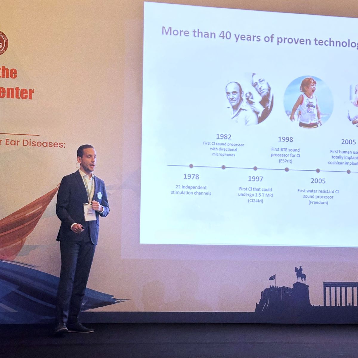 Tiago R. Felix on stage, giving a presentation.