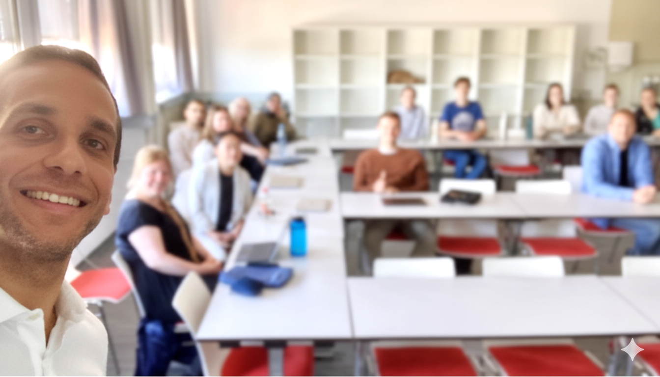 Tiago R. Felix taking a selfie in a classroom with students in the background.