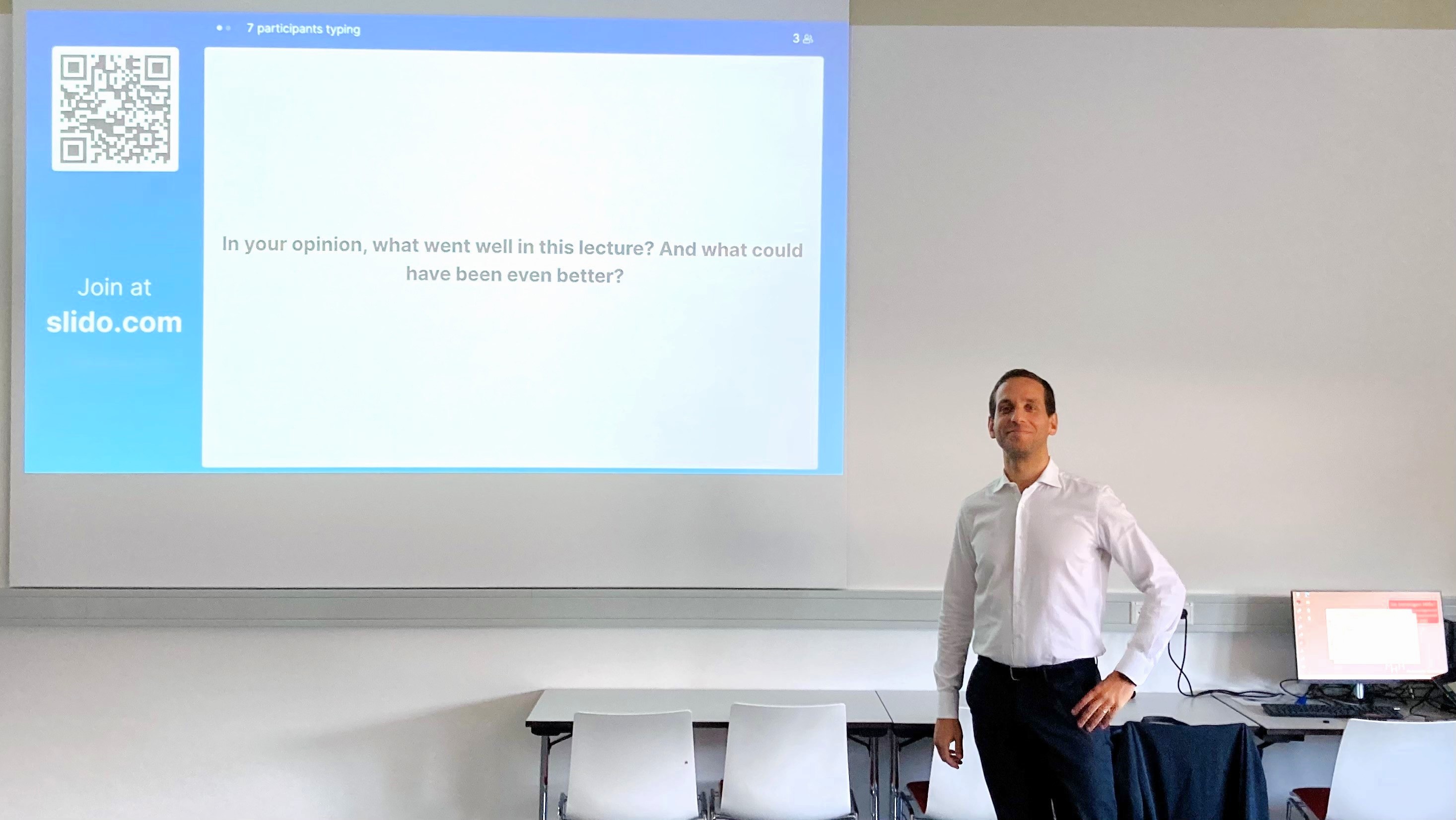 Tiago R. Felix in a classroom, awaiting feedback after a lecture.