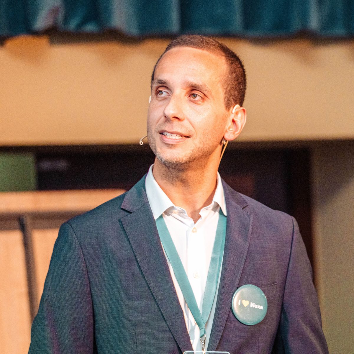 Tiago R. Felix speaking in the spotlight.